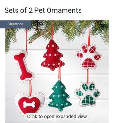 an image of christmas ornaments hanging from a tree with the text sets of 2 pet ornaments click to open expanded view