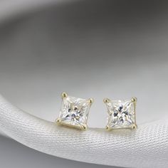 "Elegant everyday princess stud earrings set with beautifully cut White Moissanite. Full of Sparkle just like a diamond at a great price. - Moissanite info: 2 x natural Moissanites, 4 mm princess cut , 0.78 ctw Handmade by an inspired jewelry artist team with decades of experience in the craft of jewelry making. Each gemstone, each diamond is carefully picked. Using only the finest raw materials and the highest industry standard in manufacturing, design and finish. A beautiful vintage inspired p Minimalist Vvs Clarity Diamond Earrings For Wedding, Princess Cut Diamond Earrings Fine Jewelry, Elegant Princess Cut Cubic Zirconia Earrings, Luxury Princess Cut Earrings For Gift, Classic Princess Cut Diamond White Earrings, Elegant Cubic Zirconia Princess Cut Diamond Earrings, Princess Cut Diamond Earrings For Gift, Wedding Earrings With Princess Cut And Prong Setting, Elegant Princess Cut Cubic Zirconia Diamond Earrings