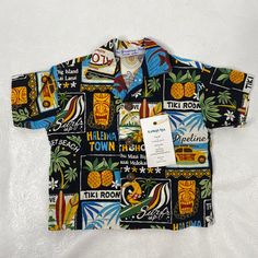 the hawaiian shirt is on display in front of a white background with an advertisement for tiki room