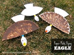 paper plate flying eagle craft on the grass