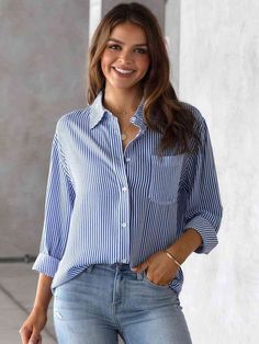 Brighten your day with a dash of down-under charm in our Aussie Striped Collared Neck Shirt! This piece captures the easy-going spirit of the Australian surf with its crisp stripes, reminiscent of the ocean's rhythm. The collared neckline adds a touch of tailored sophistication, making it a versatile pick for both office wear and weekend escapades. Crafted for comfort yet designed to stand out, this shirt will quickly become a go-to in your wardrobe. Pair it with your favorite shorts for a beach Common Thread, Uptown Girl, Women's Button Down Shirt, Casual Long Sleeve Shirts, Stylish Blouse, Cardigan Outfits, Office Attire, Loose Tops, Blonde Beauty