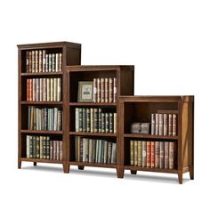 two wooden bookshelves filled with lots of books