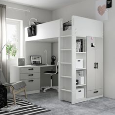 a white loft bed sitting in a bedroom next to a desk and computer chair on top of a rug