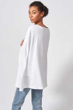 Our Cape Sweatshirt in our Bamboo and Cotton French Terry is the perfect combination of casual and chic. With enough attitude to turn heads, this style pairs well with your favorite jeans or slim trousers. Boatneck shape with facing, cape back detail with longer length, wide hem finish. - 67% Bamboo Rayon, 28% Cotton, 5% Elastin - Made in NYC - Dry Clean or Machine Wash - Our model is 5'9" wearing size S - Chest: 37", Bottom Width: 40, Length: 27 1/4" Orders are processed within three business d Silhouette Patterns, Slim Trousers, Tie Waist Dress, Sweater Set, Garment Bags, White Sweatshirt, How To Better Yourself, Favorite Jeans, Boat Neck