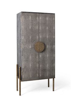 a gray cabinet with gold accents on the front and bottom, against a white background