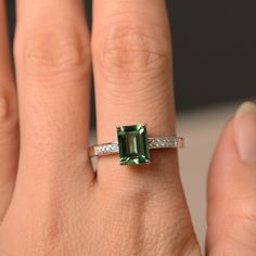 This is a gorgeous handmade creation. Its beauty is its simplicity & Elegance. The 6*8mm emerald cut green sapphire is crafted in solid sterling silver / 14k gold. It is available to customized, if you have any mind, just let me know, we will discuss with it. All item is sent in a beautiful gift box You can realize more lovely stuff clicking the link https://www.etsy.com/shop/knightjewelry?refshopsection_shophome_leftnav Please leave the correct address and you PHONE NUMBER for delivering su Green Emerald Cut Sapphire Ring, Green Emerald Cut Birthstone Ring With Accent Stones, Classic Green Tourmaline Jewelry, Green Emerald Cut Solitaire Birthstone Ring, Green Solitaire Birthstone Ring With Emerald Cut, Emerald Cut Sapphire Ring For Proposal, Green Radiant Cut Ring With Accent Stones, Green Radiant Cut Rings With Accent Stones, Radiant Cut Green Rings With Accent Stones