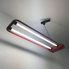 a red light hanging from the ceiling in a room