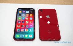 two red iphones sitting next to each other on top of a white countertop