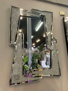 a mirror that is on the side of a wall