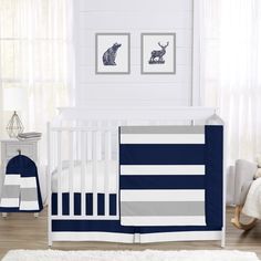 a baby crib bedding set with blue and gray stripes