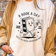 A Book A Day Keeps The Mental Breakdown Away Shirt, Read Book More Sweater, Bookworm Gift, Librarian Gift, Book Lover, Retro Bookish Shirt ORDERING: 1. Review all photos 2. Choose Size and Color from drop-down menu 3. If personalization box is available, add your text color 4. Add each shirt to cart one at a time 5. Click "Add to Cart" - you can go back to add more products 6. Click "Proceed to Checkout" 7. Add note to seller for any requests BULK DISCOUNTS AND SPECIAL REQUESTS: We offer bulk discounts and are open to special requests. Please feel free to direct message us with any inquiries. CARE INSTRUCTIONS: Wash inside out, gentle cycle, cold water, tumble dry low, medium iron. PRODUCTION AND SHIPPING: Processing time is next day. First Class Shipping is 2-5 business days (after proces Bookish Shirts, Book Clothes, Book Tshirts, Gifts For Librarians, Gifts For Bookworms, Librarian, Book Worms, Book Lovers, Books To Read