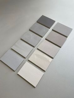 five different colors of paper laid out on top of each other