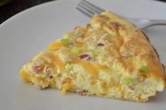 a piece of quiche on a plate with a fork