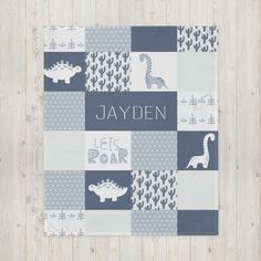 a blue and white patchwork baby blanket with the words jayden on it