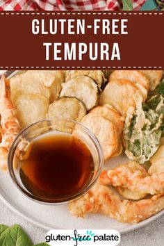 gluten - free tempura on a plate with dipping sauce and leaves