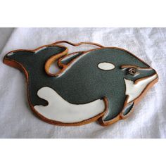 a cookie shaped like a dolphin on top of a white towel