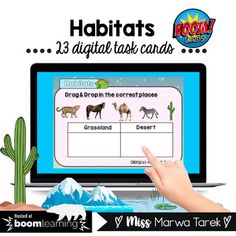 a person pointing at a computer screen with animals on it and the words habitats below