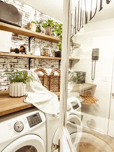 a washer and dryer in a small room