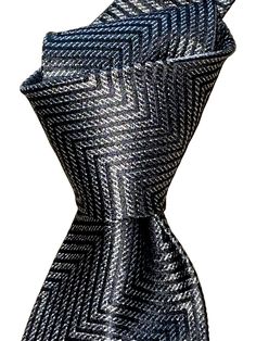 For sale:  A NWT $280 woven silk tie by TOM FORD.  One of the premier designers of our generation.  Former director of Gucci, the patterns are unique and luxurious. Designer for the clothing worn in current James Bond movies. Wear it for those occasions where you need to look your best. Details: NWT $280  Colors:  Charcoal gray Pattern:  Zig Zag Width:  3.6" Length:  59" Weight: Medium Self tipped Tie keeper Fabric:  Woven silk  Origin:  Italy **Please note - you are dealing with a retailer with over 15 years of selling experience.  Please buy with confidence.  Loc: Fl2- Luxury Ties For Office Suit Accessories, Luxury Ties For Office, Luxury Silver Suit And Tie Accessories For Business, Luxury Neckwear For Office - Standard Tie, Luxury Silver Suit And Tie Accessories For Formal Occasions, Luxury Business Neckwear, Standard Tie, Black Silk Tie For Formal Occasions, Luxury Business Neckwear Standard Tie, Black Silk Ties For Formal Occasions