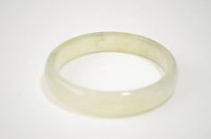 "Beautiful vintage estate icy green jadeite jade bangle. It is in very good vintage condition with natural stone lines, measures 7.25\" long, 60 mm of inside diameter, 14 mm wide, weighs 42 grams. Shipping & Handling: We usually ship within 1 business day. If you have any questions about this item, please contact us for more details. I do offer international shipping, but please message me first before purchasing so I can make a separate listing for you! S4" Vintage Jade Round Bracelets, Vintage Round Jade Bracelets, Vintage Jade Bracelets, Jade Bangle Bracelet, Jade Bangle, Bangle Bracelet, Natural Stone, Natural Stones, San Diego