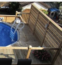 an above ground swimming pool with decking