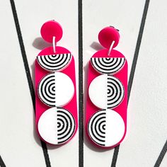 Channel your inner retro diva with these earrings inspired by the iconic Go-Go era. The lively colors and swinging design capture the spirit of fun. Created in hot pink and white acrylic, these earrings are 2 7/8" tall, the dangle is 2 1/4" long. They have stainless steel ear posts. Trendy White Plastic Earrings, Trendy White Earrings, Retro White Dangle Earrings, Retro White Drop Earrings, Pink Plastic Drop Earrings, Retro Pink Drop Earrings, Go Go Girl, Go Girl, Acrylic Jewellery