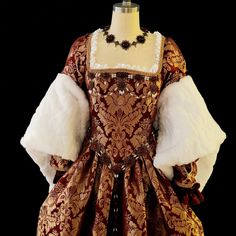 This Tudor style ensemble is perfect for your next Ren Faire, Theatre production, Larp, or any other event! Included is the outer gown, underskirt, and fore sleeves. The outer gown is made in a beautiful burgundy brocade with fur accented sleeves, and laces up in the back for a perfect fit. It is fully lined on the bodice part, and the skirt has clean finished seams. The fore sleeves are removable and made in a matching brocade and satin. Underskirt is full (made with almost 10 yards of fabric!) Tudor Dress Aesthetic, Tudor Aesthetic, Kingdom Ideas, Tudor Gown, 17th Century Clothing, Tudor Dress, Tudor Fashion, Theatre Production, Tudor History