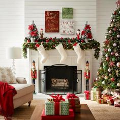 a living room decorated for christmas with presents and stockings on the fireplace mantels