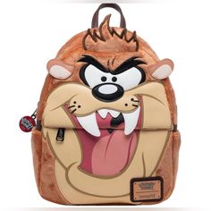 Grrrr... Taz Is Hungry, And He Is Ready To Eat Anything! Bring This Bundle Of Chaos With You In Our Loungefly Warner Brothers Looney Tunes Tasmanian Devil Plush Cosplay Mini Backpack - 707 Street Exclusive. This Loungefly Features Taz As A Plush Cosplay. You'll Find Applique And Embroidered Facial Features On The Front. Flip The Bag Over To Find Taz Doing His Classic Tornado Move - And Unzip The Bag To Find More Of Taz In The Interior Lining. You'll Also Find A Classic Looney Tunes Logo Zipper P Front Flip, Stitch Backpack, Loungefly Bag, Tasmanian Devil, Bag Display, Plush Backpack, Unique Purses, Disney Bag, Novelty Bags