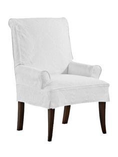 a white chair that is upholstered with fabric