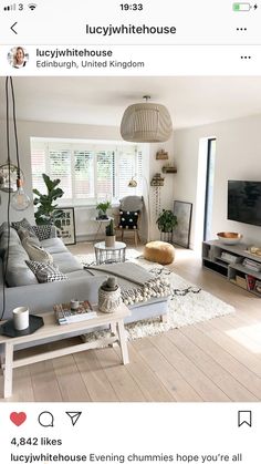 a living room filled with furniture and a flat screen tv