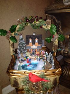 a basket filled with christmas decorations on top of a table