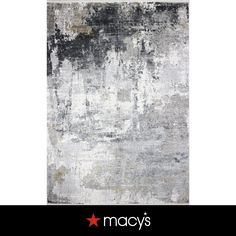 an abstract rug with grey and white colors