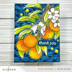 a thank card with oranges and flowers on it