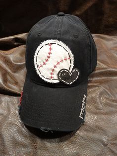 PLEASE READ MY SHIPPING DETAILS & ORDER POLICIES BEFORE YOU ORDER  This super cute Baseball LOVE Mom Bling Ball Cap includes: **Black distressed ball cap **Stitched, applique baseball with rhinestone embellishing **Fabric appliqued heart **mom on bill. If you want something else, Custom Personalized Adjustable Hats, Personalized Curved Bill Hat For Baseball Season, Gift Flat Bill Baseball Cap One Size, Custom Black Hats As Gifts, Customizable Adjustable Black Hats, Black Hats With Letter Print As Gifts, Black Hats For Mother's Day Gift, Casual Black Hat For Birthday, Customizable Black Hat As Gift