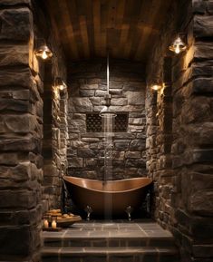 a large bath tub sitting in the middle of a stone wall with lights on it