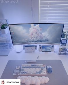 a desktop computer sitting on top of a desk next to a keyboard and mouse pad