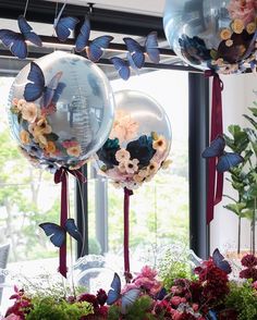 balloons with flowers and butterflies hanging from them