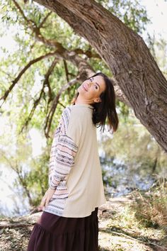 Stay cozy and stylish with our Brielle Cardigan. Its cream color and Aztec print will add a touch of happiness to your wardrobe. Made with a soft waffle knit, this cardigan will keep you warm and comfortable, whether you're out on the town or relaxing at home. Fits true to size. Model is wearing medium and is 5'8". Plus model is wearing 2X and is 5'7". Size Chart Length Bust S 30" 44" M 31" 48" L 31" 50" 1x 31" 52" 2x 32" 54" 3x 34" 56" *All measurements are approximate and done while hanging. B Cozy Beige Sweater For Day Out, Casual Beige Jacquard Knit Cardigan, Cream Soft Knit Cardigan For Loungewear, Cream Soft Knit Sweater For Day Out, Cozy Cream Sweater For Day Out, Cream Bohemian Sweater For Layering, Cream Long Sleeve Jacquard Knit Top, Bohemian Cream Sweater For Layering, Cream Jacquard Knit Long Sleeve Tops