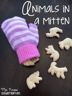 the mittens are made out of cookies and have animals on them