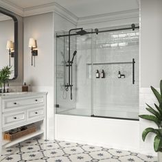 a bathroom with a sink, mirror and shower stall in the middle of the room