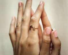 Dive into the joy of spotting a rainbow with our Mini Rainbow Ring, a charming symbol of luck, unity, and promise for the future, handcrafted to reflect our dedication to sustainable and ethical practices. This delightful ½” x ½” rainbow ring is meticulously entirely handmade. It's cut, shaped, soldered, and hammered by our valued artisans, embodying the same careful craftsmanship as our Rainbow Necklace. Crafted with care, this ring is available in a range of metals, including a mixed, tri-meta Adjustable Rainbow Jewelry For Everyday, Unique Rainbow Rings As Gift, Unique Rainbow Colored Rings As Gift, Unique Rainbow Rings For Gifts, Handmade Rainbow Ring Jewelry, Rainbow Adjustable Minimalist Jewelry, Handmade Rainbow Colored Ring Jewelry, Handmade Rainbow Jewelry Ring, Minimalist Adjustable Rainbow Jewelry