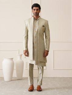 Green Sequnied & resham embroidered IndoWestern Sherwani for the Groom and his squad family & firends. Crafted from the most luxurious silk, this item will have you feeling like a royal king. This indo-western sherwani, including an open sherwani at the front and an inside sleevless kurta paired with slim-cut trousers. Note: Some color variations may occur owing to photography causes. Up to 1 inch of measurement fluctuation is possible. COST INCLUDES SHERWANI,TROUSER & INNER JACKET Formal Pista Green Traditional Wear For Eid, Formal Embroidered Pista Green Bandhgala, Traditional Pista Green Sherwani For Formal Occasions, Formal Pista Green Sherwani For Eid, Pista Green Sherwani For Formal Festive Occasions, Pista Green Sherwani For Formal Eid Celebrations, Formal Pista Green Bandhgala With Resham Embroidery, Pista Green Dabka Work Sets For Formal Occasions, Festive Pista Green Formal Sherwani