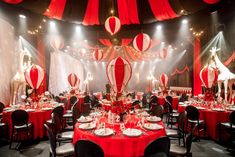 a banquet room with red and white decorations