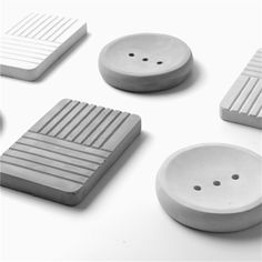 four different types of bathroom accessories on a white surface