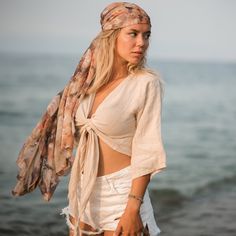 "Stay cool and fresh in this lightweight tank, crafted from breathable linen, one of our most beloved fabrics for its luxurious hand feel. The linen crop tops are designed with an adjustable wrap fit that can be adjusted from both the front and back, making it suitable for any body type. It's made of 100% natural, medium-weight linen that's been soft-washed and Oeko-Tex certified.  The linen is lightweight and breathable, making it perfect for any occasion, from formal events to casual outings with friends.  Size Bust: 39\" inches-98cm Waist: 29\" inches-73cm It is completely organic and hypoallergenic, making it perfect for those with sensitive skin. Care To care for the dress, wash it in lukewarm water at 40oC/104oF. Be careful not to use high temperatures, as this may cause shrinkage of Spring Bohemian Linen Blouse, Summer Beige Ramie Blouse, Linen Beachwear Tops For Summer, Linen Tops For Summer Beachwear, Summer Beach Blouse In Ramie, Summer Beach Blouse Made Of Ramie, Free-spirited Spring Blouse For Beach, Free-spirited Spring Beach Blouse, Beige Ramie Top For Summer