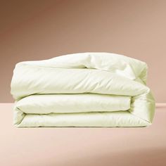 two white pillows stacked on top of each other