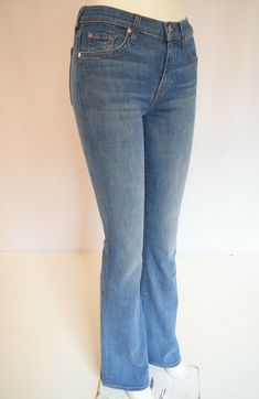 You will Receive a NEW Jean  7 Seven For All Mankind  "ALI  CLASSIC  FLARE"   in HART-MEDIUM BLUE  For Woman's  SZ 30 New with tags 5 pocket design Slightly Flared Leg Opening Clean Back Pockets Whiskers on the front  for a worn-in look. Front and back fading  Zip fly and button closure Style#AU0433101 92% Cotton     6% Polyester    2% Spandex  ASSEMBLED IN MEXICO FINISH IN USA     ACTUAL MEASUREMENTS: Waist: 15 1/2" ALIGNED (Matching up the front and the back of the waistband) Front Rise: 9 1/2 Blue Flare Jeans With Five Pockets, Stretch Mid-rise Blue Flare Jeans, Fitted Straight Leg Light Indigo Bottoms, Fitted Light Indigo Straight Leg Bottoms, Mid-rise Blue Fitted Flare Jeans, Light Indigo Fitted Straight Leg Bottoms, Mid-rise Blue Flare Jeans, Fitted Blue Flare Jeans With Five Pockets, Blue Mid-rise Flare Jeans