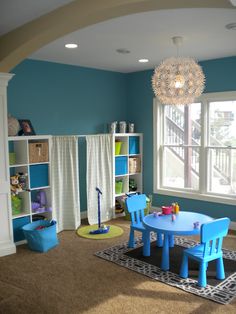 the room is clean and ready to be used as a child's playroom