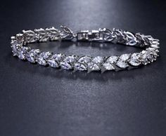 Luxury Leaf Chain Bracelet White AAA Cubic Zircon Woman's Jewelry Wedding Party Gift Fine or Fashion: FashionItem Type: BraceletsShape\pattern: PlantChain Type: Link ChainClasp Type: Toggle-claspsFunction: Mood TrackerStyle: ClassicBracelets Type: Chain & Link BraceletsMetals Type: CopperGender: WomenSetting Type: Prong SettingMaterial: Cubic Zirconia Droplet Earrings, Wedding Necklace Set, Branch Earrings, Cubic Zirconia Bracelet, Leaf Bracelet, Leaf Jewelry, Cz Jewelry, Bridal Bracelet, Mood Tracker